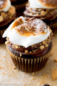 S'mores have never tasted so good! Moist and rich homemade chocolate cupcakes filled with marshmallow, topped with chocolate frosting, graham cracker crumbs, and a toasted marshmallow.